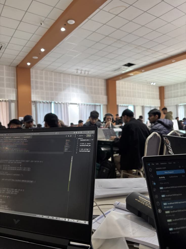 Laptops open at a collaborative coding workspace